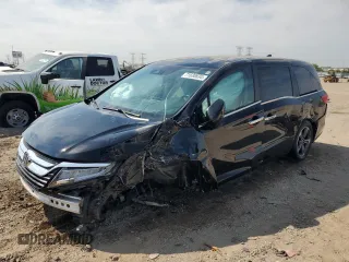 2020 Honda Odyssey Touring z VIN 5FNRL6H8XLB031189, wystawiony jako Copart lot #71530834 z przebiegiem 26 815 mil mil oraz Szkoda całkowita • Salvage title. Historia ofert i sprzedaży dostępna na DreamBid. Obrazek 1.