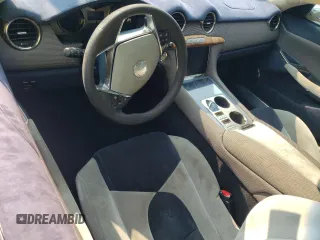 2012 Fisker Karma EcoChic z VIN YH4K16AA7CA000341, wystawiony jako Copart lot #62492854 z przebiegiem Nie podano mil oraz Szkody całkowita. Historia ofert i sprzedaży dostępna na DreamBid. Obrazek 8.