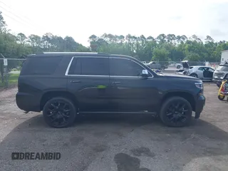 2015 Chevrolet Tahoe LTZ with VIN 1GNSCCKC5FR103676, listed as a IAAI auction lot 42456913 with 214,009 mi miles and . Bid and sale history available at DreamBid. Image 12.