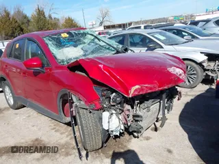 2014 Mazda CX-5 Touring z VIN JM3KE2CY2E0364488, wystawiony jako IAAI lot #41635188 z przebiegiem 127 688 mil mil oraz . Historia ofert i sprzedaży dostępna na DreamBid. Obrazek 1.