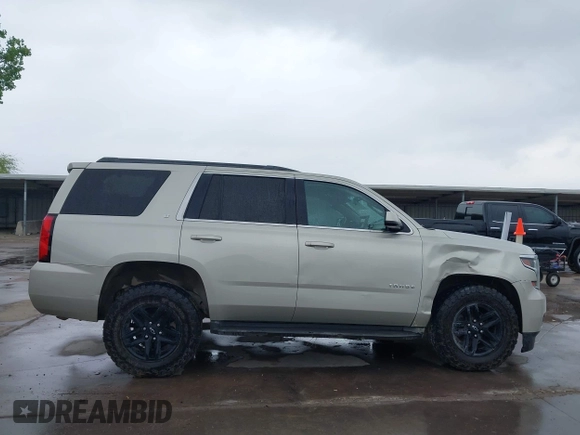 2015 Chevrolet Tahoe LT with VIN 1GNSKBKC3FR192693, listed as a IAAI auction lot 42142810 with Not provided miles and . Bid and sale history available at DreamBid. Image 14.