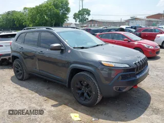 2016 Jeep Cherokee Trailhawk with VIN 1C4PJMBS0GW267521, listed as a IAAI auction lot 42406051 with 90,090 mi miles and . Bid and sale history available at DreamBid. Image 1.