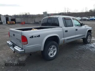 2004 Dodge Dakota SLT with VIN 1D7HG48N04S603763, listed as a IAAI auction lot 41607984 with 157,360 mi miles. Bid and sale history available at carsss.com. Image 4.