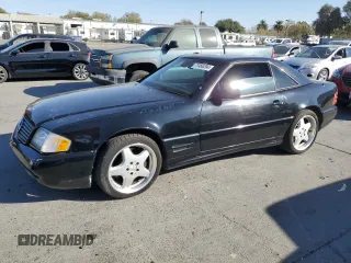 2001 Mercedes-Benz SL-Class with VIN WDBFA68F01F199440, listed as a Copart auction lot 77466294 with 148,000 mi miles and Clean Title. Bid and sale history available at carsss.com. Image 1.