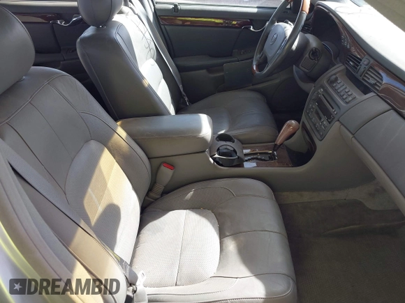 2003 Cadillac DeVille DTS z VIN 1G6KF57923U260229, wystawiony jako IAAI lot #41415468 z przebiegiem 58 012 mil mil oraz . Historia ofert i sprzedaży dostępna na DreamBid. Obrazek 5.