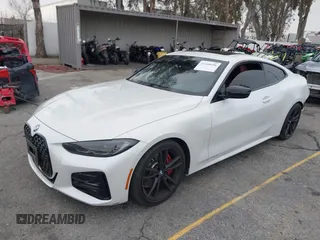 2022 BMW 4 Series 430i with VIN WBA53AP02NCK91287, listed as a IAAI auction lot 41448686 with 27,046 mi miles and . Bid and sale history available at carsss.com. Image 2.