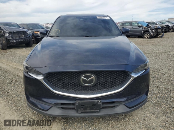 2017 Mazda CX-5 Grand Touring with VIN JM3KFADL2H0221149, listed as a Copart auction lot 50606915 with 140,518 mi miles and Clean Title. Bid and sale history available at carsss.com. Image 5.