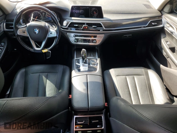 2017 BMW 7 Series 740i with VIN WBA7E2C50HG739565, listed as a Copart auction lot 64584885 with 114,496 mi miles and Salvage title. Bid and sale history available at DreamBid. Image 8.