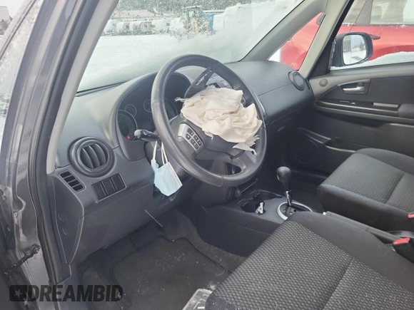 2013 Suzuki SX4 z VIN JS2YA5A34D6100052, wystawiony jako Copart lot #85862654 z przebiegiem 105 114 mil mil oraz Tytuł czysty. Historia ofert i sprzedaży dostępna na DreamBid. Obrazek 7.
