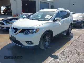 2016 Nissan Rogue SV with VIN KNMAT2MT1GP686630, listed as a IAAI auction lot 42000985 with 131,058 mi miles. Bid and sale history available at carsss.com. Image 17.