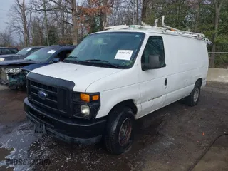2011 Ford Econoline Cargo Van Commercial with VIN 1FTNE2EL6BDA76582, listed as a IAAI auction lot 41088478 with 105,002 mi miles. Bid and sale history available at carsss.com. Image 2.