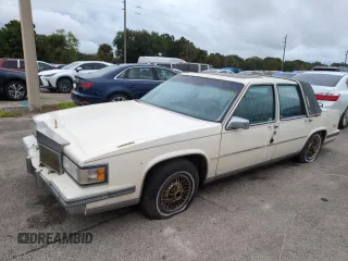 1987 Cadillac DeVille z VIN 1G6CD5182H4359506, wystawiony jako Copart lot #74501494 z przebiegiem Nie podano mil oraz Nie do naprawy • Non repairable. Historia ofert i sprzedaży dostępna na DreamBid. Obrazek 1.