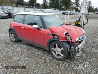 2004 MINI Hardtop with VIN WMWRC33464TJ54261, listed as a Copart auction lot 55150205 with 212,636 mi miles and Salvage Title. Bid and sale history available at DreamBid. Image 4.