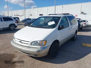 1999 Toyota Sienna LE with VIN 4T3ZF13C1XU152733, listed as a IAAI auction lot 40819395 with 184,540 mi miles. Bid and sale history available at carsss.com. Image 2.