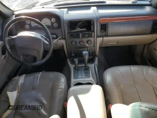 1999 Jeep Grand Cherokee Laredo with VIN 1J4GW58N9XC633464, listed as a Copart auction lot 84682454 with 212,738 mi miles and Salvage title. Bid and sale history available at DreamBid. Image 8.
