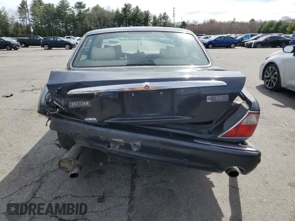 2002 Jaguar XJ 8 with VIN SAJDA14C62LF40435, listed as a Copart auction lot 52022645 with 153,703 mi miles and Salvage title. Bid and sale history available at DreamBid. Image 6.
