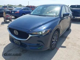 2018 Mazda CX-5 Touring z VIN JM3KFACM7J1410275, wystawiony jako IAAI lot #42248830 z przebiegiem 101 125 mil mil oraz . Historia ofert i sprzedaży dostępna na DreamBid. Obrazek 17.