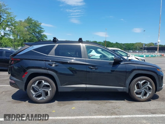 2022 Hyundai Tucson SEL z VIN 5NMJFCAE5NH046879, wystawiony jako IAAI lot #42295125 z przebiegiem 24 448 mil mil oraz . Historia ofert i sprzedaży dostępna na DreamBid. Obrazek 13.