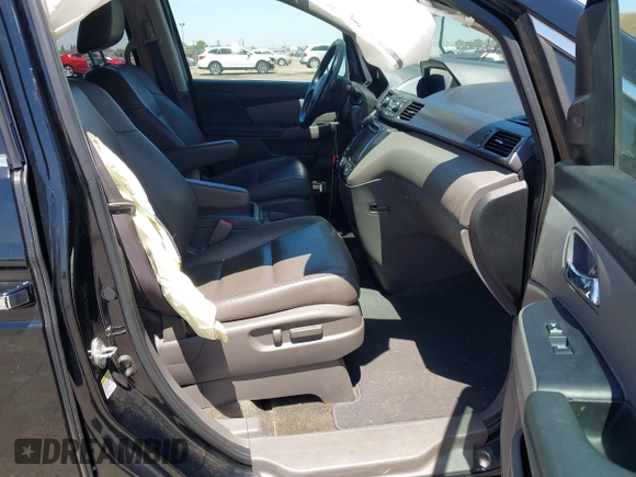 2014 Honda Odyssey Touring with VIN 5FNRL5H99EB133864, listed as a IAAI auction lot 42201359 with 122,490 mi miles and . Bid and sale history available at DreamBid. Image 5.