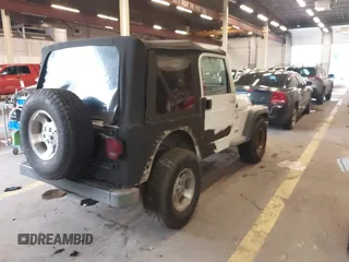 1999 Jeep Wrangler Sport with VIN 1J4FY19S6XP449014, listed as a IAAI auction lot 41893297 with 181,114 mi miles. Bid and sale history available at carsss.com. Image 4.