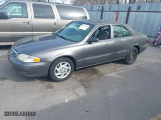 2001 Mazda 626 LX with VIN 1YVGF22C815218444, listed as a IAAI auction lot 41940404 with 143,080 mi miles. Bid and sale history available at carsss.com. Image 2.
