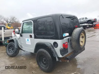 2006 Jeep Wrangler Sport Right Hand Drive with VIN 1J4F449SX6P764491, listed as a IAAI auction lot 41709726 with 290,798 mi miles. Bid and sale history available at carsss.com. Image 3.