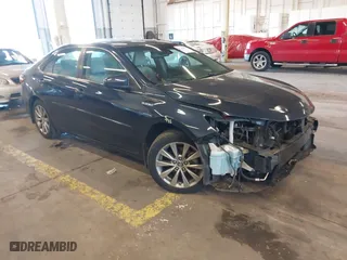 2015 Toyota Camry Hybrid LE with VIN 4T1BD1FK1FU143967, listed as a IAAI auction lot 41245891 with 106,982 mi miles. Bid and sale history available at carsss.com. Image 1.