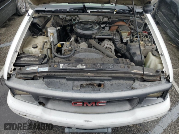 1995 GMC Sonoma z VIN 1GTCS14Z5S8536775, wystawiony jako Copart lot #77086374 z przebiegiem 70 419 mil mil oraz Tytuł czysty. Historia ofert i sprzedaży dostępna na DreamBid. Obrazek 11.