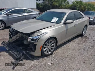 2014 Cadillac CTS Luxury RWD z VIN 1G6AR5SX4E0141195, wystawiony jako IAAI lot #42144565 z przebiegiem 80 267 mil mil oraz . Historia ofert i sprzedaży dostępna na DreamBid. Obrazek 2.