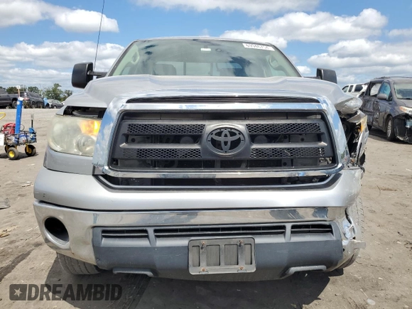 2012 Toyota Tundra 4WD Truck with VIN 5TFCY5F15CX013941, listed as a Copart auction lot 69946754 with 163,228 mi miles and Salvage Title. Bid and sale history available at carsss.com. Image 5.