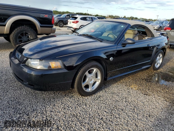 2004 Ford Mustang Deluxe with VIN 1FAFP44414F125267, listed as a Copart auction lot 74595714 with 0 mi miles and Salvage Title. Bid and sale history available at carsss.com. Image 1.
