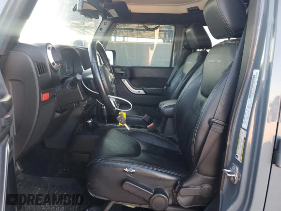 2014 Jeep Wrangler Unlimited Rubicon with VIN 1C4HJWFG9EL199501, listed as a Copart auction lot 61443595 with 86,940 mi miles and Salvage title. Bid and sale history available at DreamBid. Image 7.