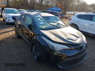 2021 Toyota C-HR LE with VIN JTNKHMBX1M1118203, listed as a IAAI auction lot 40936962 with 18,424 mi miles. Bid and sale history available at carsss.com. Image 1.
