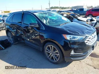 2021 Ford Edge Titanium z VIN 2FMPK3K97MBA35897, wystawiony jako IAAI lot #41629471 z przebiegiem 55 647 mil mil oraz . Historia ofert i sprzedaży dostępna na DreamBid. Obrazek 1.