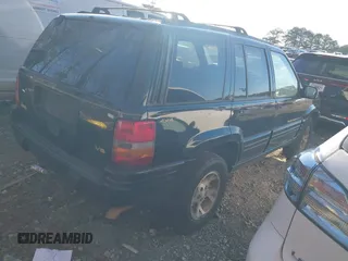 1997 Jeep Grand Cherokee Limited with VIN 1J4GZ78Y7VC688375, listed as a IAAI auction lot 41255946 with 216,544 mi miles. Bid and sale history available at carsss.com. Image 4.