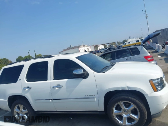 2013 Chevrolet Tahoe LTZ with VIN 1GNSKCE04DR374682, listed as a IAAI auction lot 42779526 with 139,533 mi miles and . Bid and sale history available at DreamBid. Image 13.