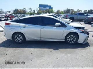 2021 Toyota Prius LE with VIN JTDKAMFP1M3180370, listed as a IAAI auction lot 41928512 with 83,249 mi miles and . Bid and sale history available at DreamBid. Image 14.
