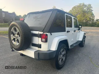 2016 Jeep Wrangler Unlimited Sahara with VIN 1C4BJWEG5GL215915, listed as a Copart auction lot 61690145 with 143,925 mi miles and Clean title. Bid and sale history available at DreamBid. Image 4.