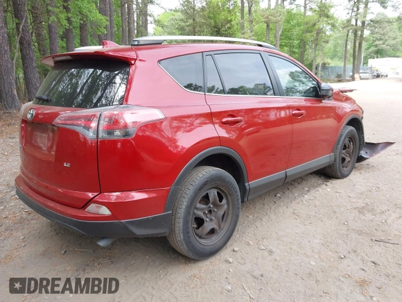 2016 Toyota RAV4 LE with VIN JTMZFREV4GJ062701, listed as a IAAI auction lot 42084694 with 121,553 mi miles and . Bid and sale history available at DreamBid. Image 4.