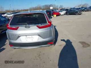 2018 Honda CR-V EX with VIN 7FARW2H56JE097214, listed as a IAAI auction lot 42061999 with 74,862 mi miles and . Bid and sale history available at DreamBid. Image 17.