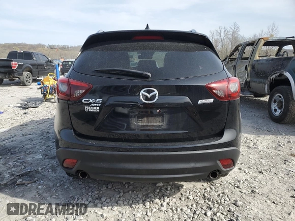2016 Mazda CX-5 Touring z VIN JM3KE4CY0G0667171, wystawiony jako Copart lot #51579005 z przebiegiem 39 487 mil mil oraz Szkoda całkowita • Salvage title. Historia ofert i sprzedaży dostępna na DreamBid. Obrazek 6.