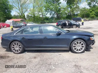 2015 Audi A8 4.0T with VIN WAU32AFD4FN002477, listed as a IAAI auction lot 42157514 with 151,729 mi miles and . Bid and sale history available at DreamBid. Image 13.