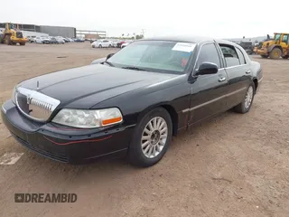 2008 Lincoln Town Car z VIN 2LNHM85WX8X636193, wystawiony jako IAAI lot #41916910 z przebiegiem Nie podano mil oraz . Historia ofert i sprzedaży dostępna na DreamBid. Obrazek 16.