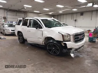 2015 GMC Yukon SLT z VIN 1GKS2BKC6FR604294, wystawiony jako IAAI lot #41908522 z przebiegiem 123 991 mil mil oraz . Historia ofert i sprzedaży dostępna na DreamBid. Obrazek 1.