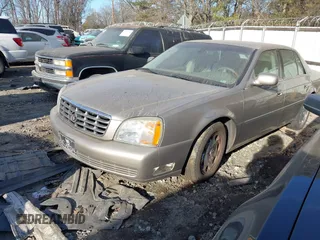2002 Cadillac DeVille DHS z VIN 1G6KE57Y22U225134, wystawiony jako IAAI lot #41350531 z przebiegiem 126 457 mil mil oraz . Historia ofert i sprzedaży dostępna na DreamBid. Obrazek 2.