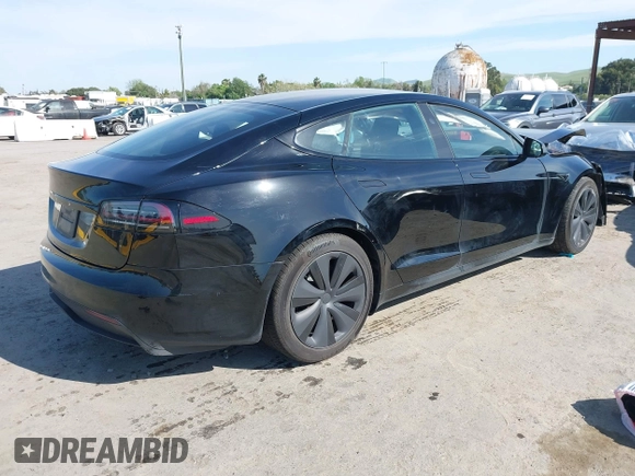 2023 Tesla Model S with VIN 5YJSA1E54PF531021, listed as a IAAI auction lot 42014104 with Not provided miles and . Bid and sale history available at DreamBid. Image 4.