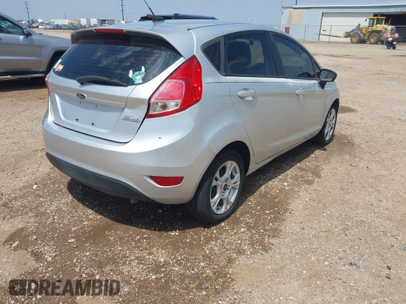 2014 Ford Fiesta SE with VIN 3FADP4EJ4EM151911, listed as a IAAI auction lot 42096321 with 129,938 mi miles and . Bid and sale history available at DreamBid. Image 4.