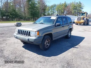 1997 Jeep Grand Cherokee Laredo with VIN 1J4GZ58S7VC713517, listed as a IAAI auction lot 42062214 with 205,533 mi miles. Bid and sale history available at carsss.com. Image 2.