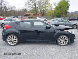 2012 Hyundai Veloster w/Gray Int z VIN KMHTC6AD6CU054422, wystawiony jako IAAI lot #41930634 z przebiegiem 144 681 mil mil oraz . Historia ofert i sprzedaży dostępna na DreamBid. Obrazek 14.