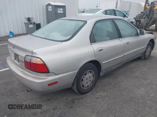 1997 Honda Accord Value with VIN 1HGCD568XVA184006, listed as a IAAI auction lot 41818518 with 276,230 mi miles and . Bid and sale history available at carsss.com. Image 4.